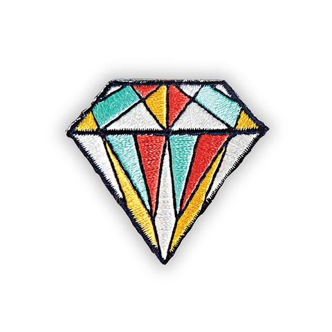 An embroidered fabric patch of a diamond gemstone composed of four colours: white red, gold, and light blue. 
